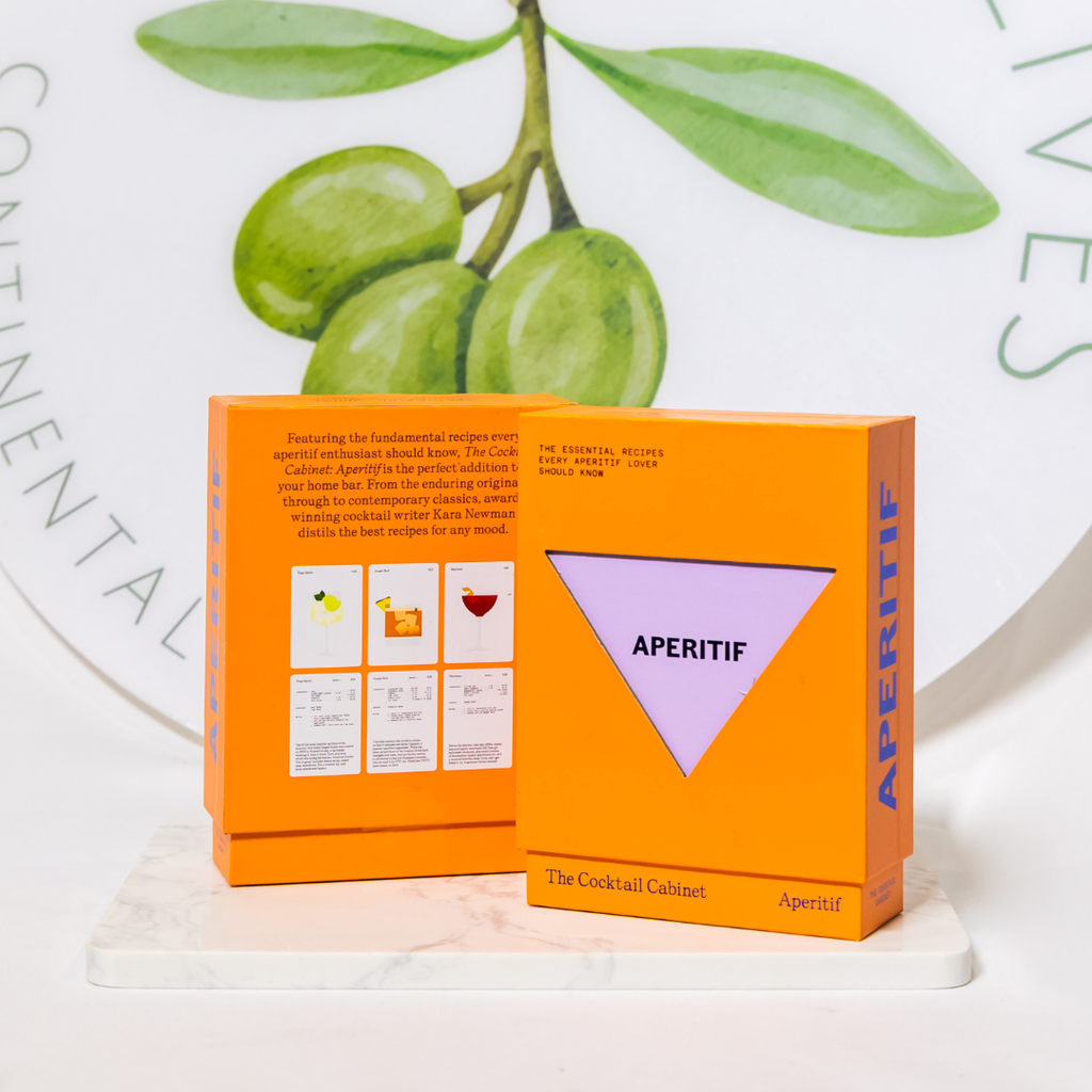 Orange box labeled 'Aperitif' with green olives and leaves on a light background