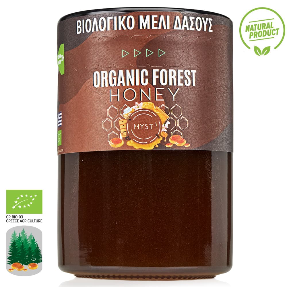 Jar of organic forest honey with Greek text and natural product labels on a white background