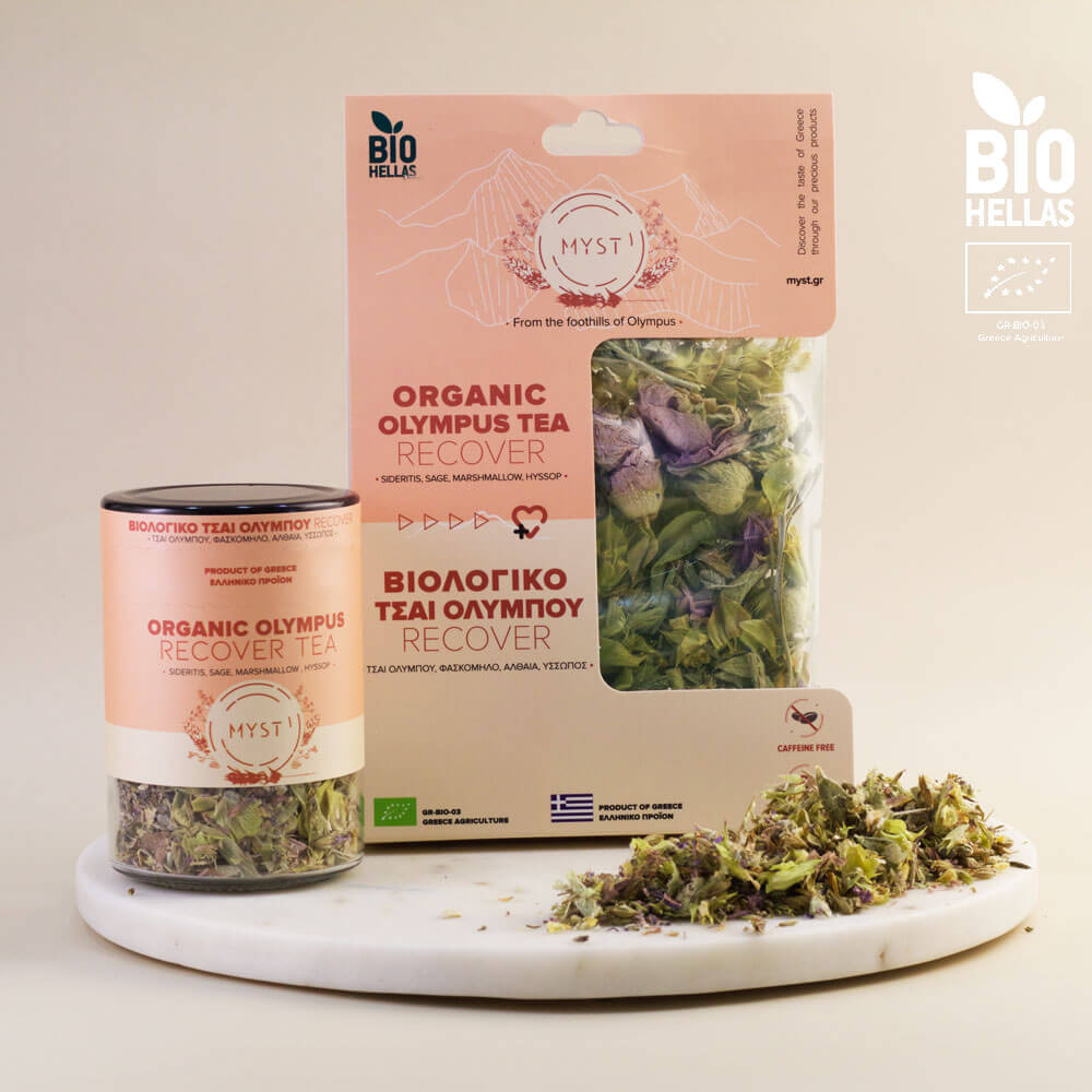 Organic Olympus tea packaging and loose tea leaves on a white surface with 'BIO HELAS' branding.