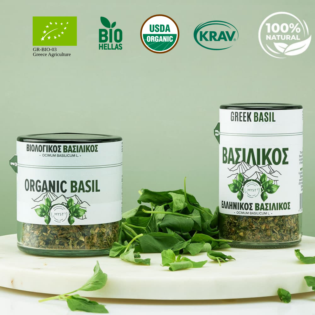 Two jars of organic Greek basil with labels and certification logos on a light green background.
