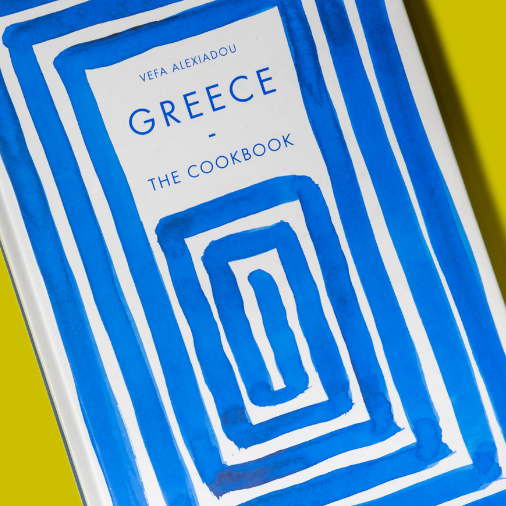 Book titled 'Greece: The Cookbook' by Phaidon on a yellow background