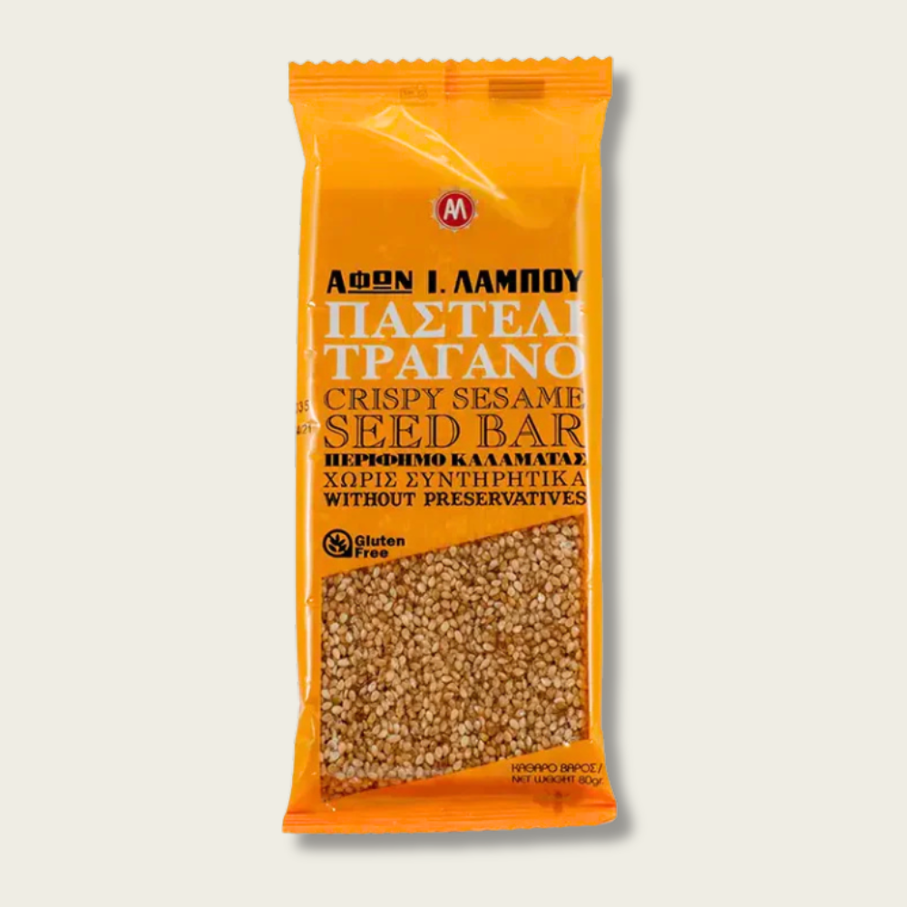 Packaged snack bar with sesame seeds on an orange background