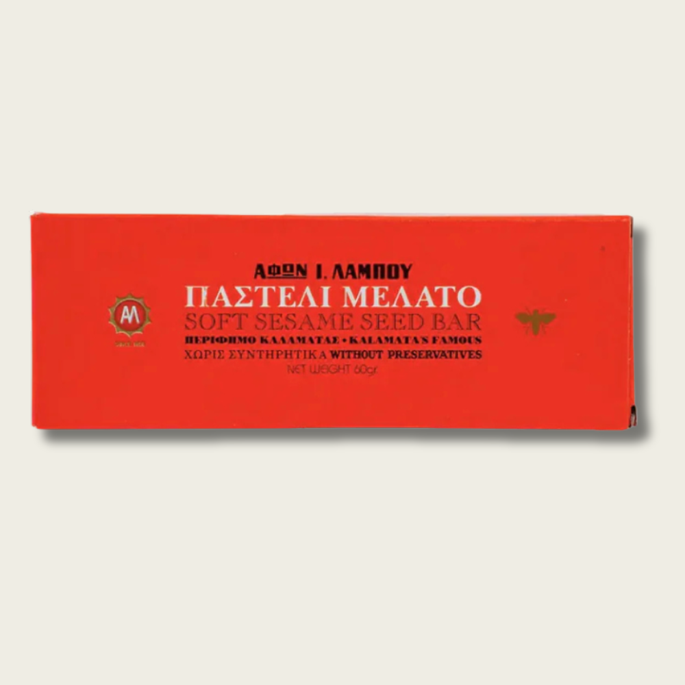 Red packaging of a soft sesame seed bar with Greek text on a light gray background