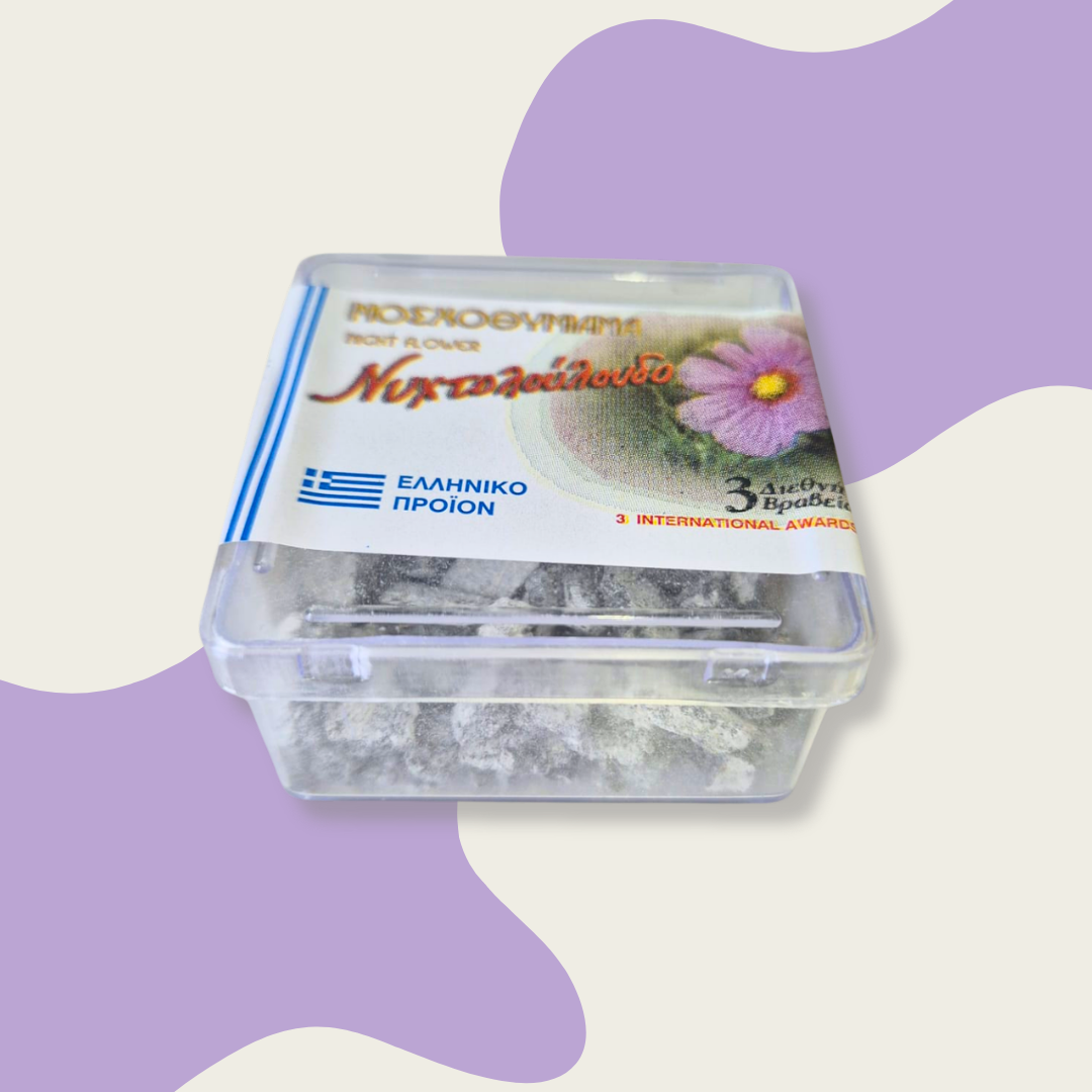 Container of flowers with Greek branding on a light purple background