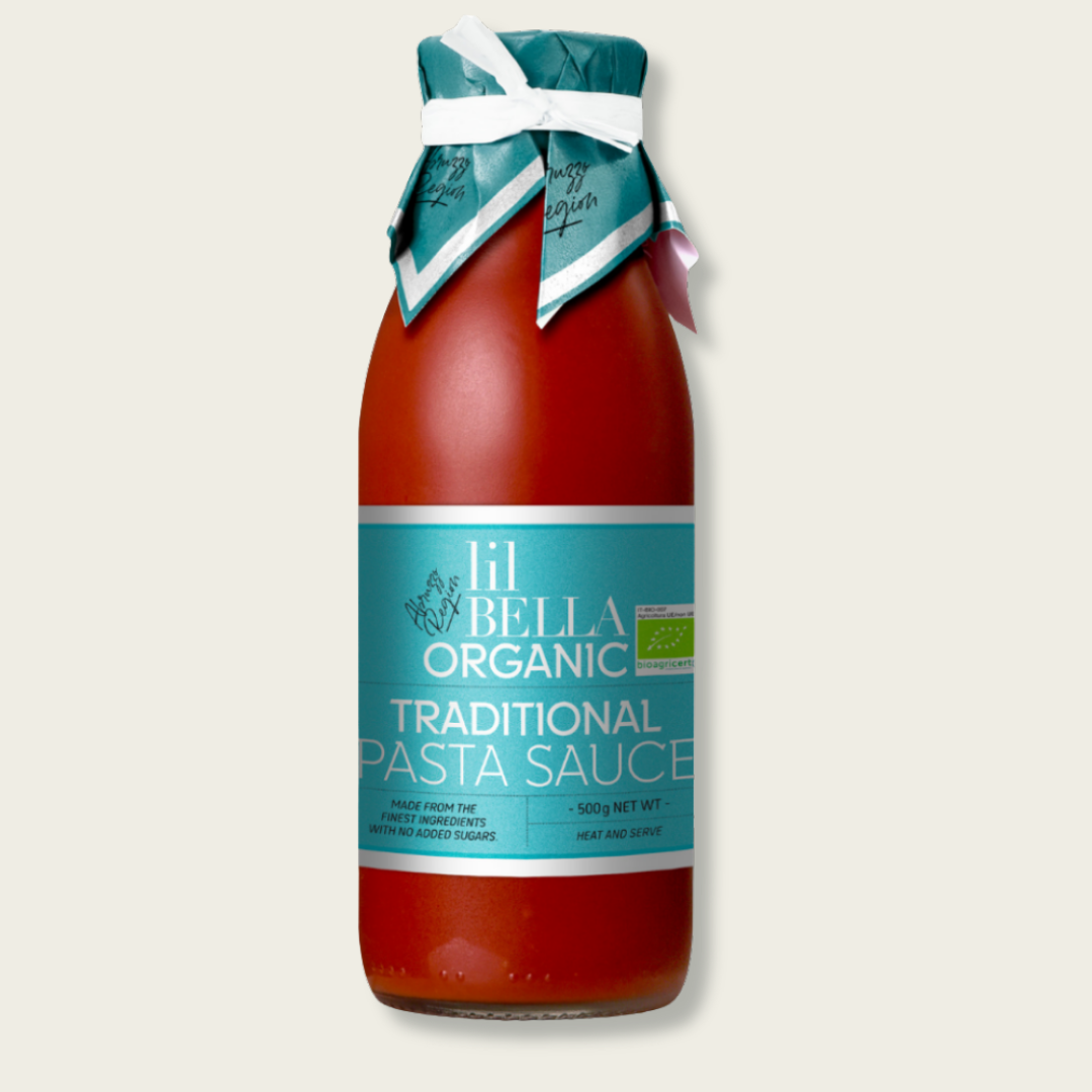 Bottle of lil Bella Organic Traditional Pasta Sauce on a light beige background