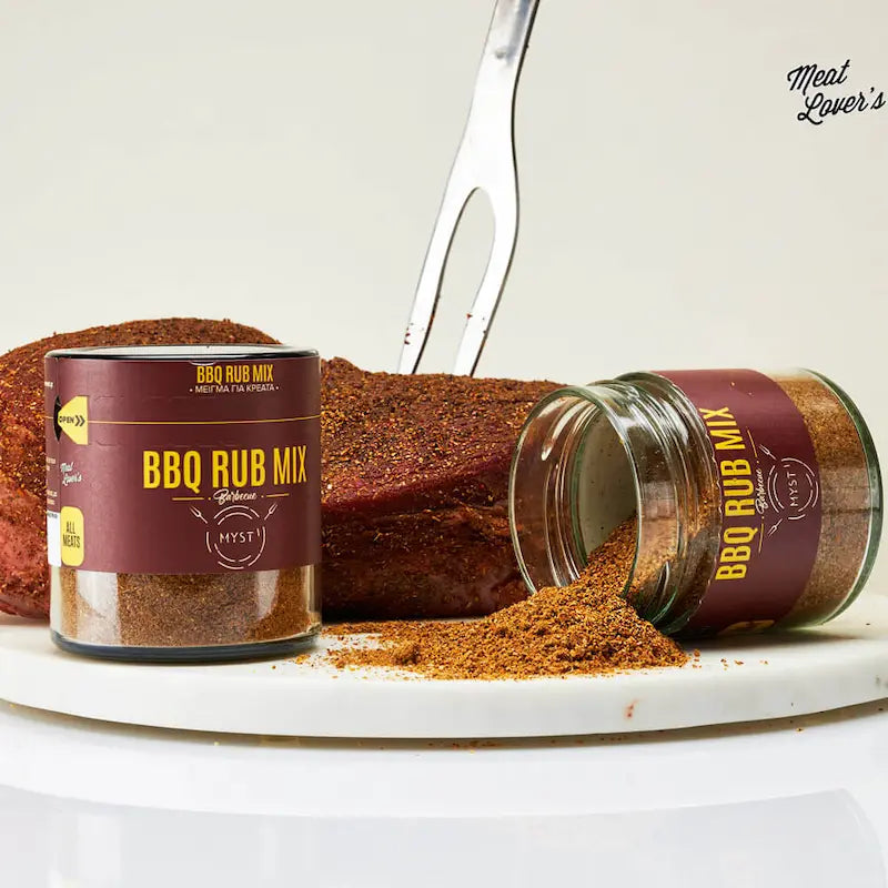 BBQ Rub Mix with a jar and can on a white surface with a cake in the background.