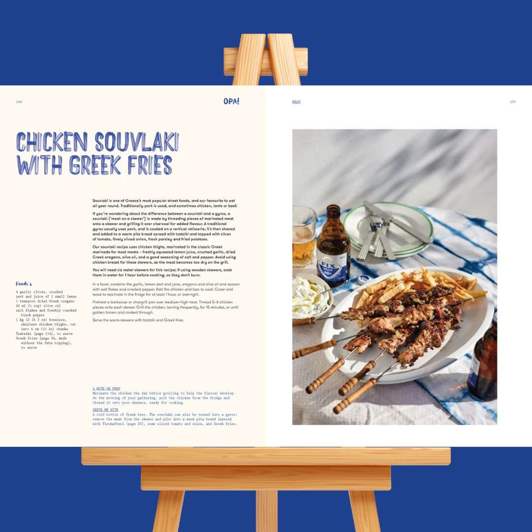 Recipe card for chicken souvlaki with Greek fries on a wooden easel.