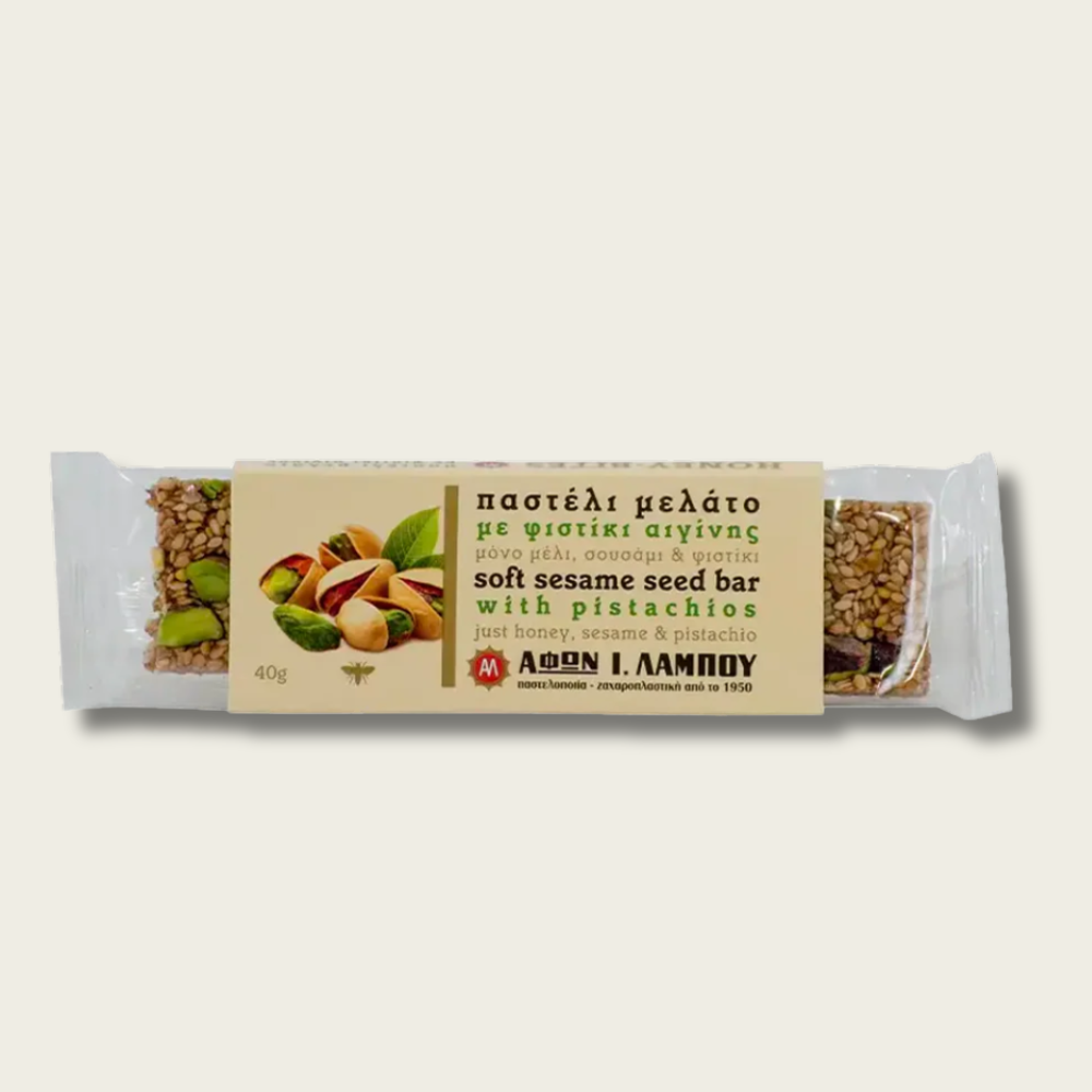 Bar of soft sesame seed with pistachios on a light gray background