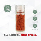 Glass spice jar with red spice, surrounded by green labels indicating '100% natural', 'Vegan', 'Gluten Free', and 'Additives Free'.
