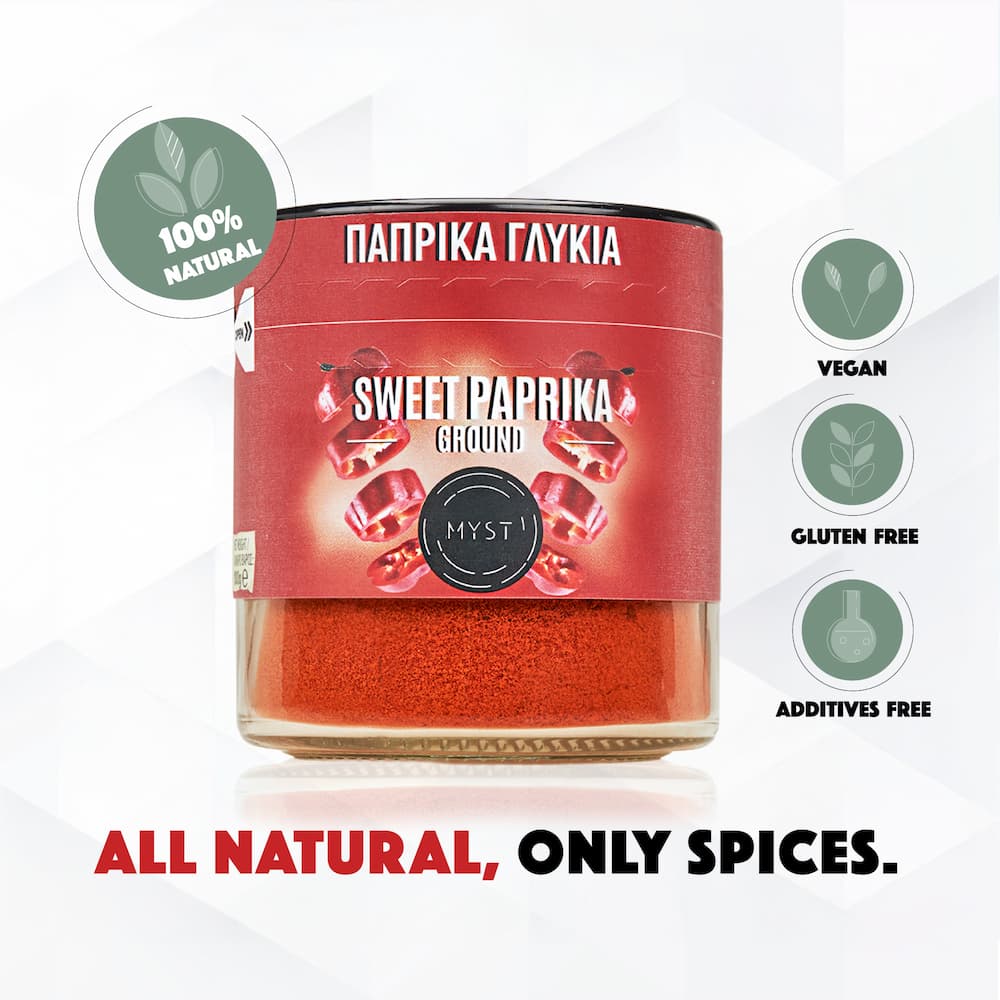 Jar of sweet paprika with branding and health benefits on a white background