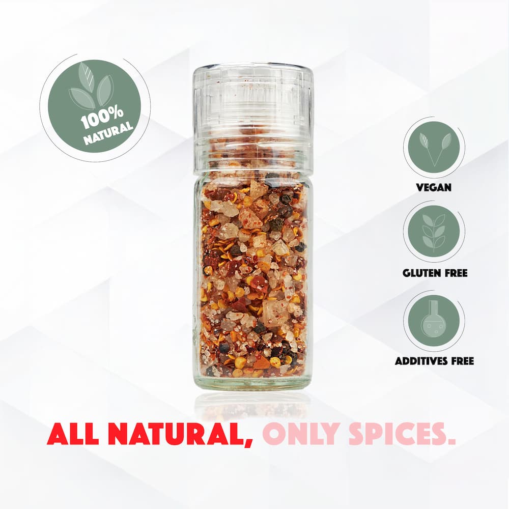 Glass jar of spices with natural, vegan, gluten-free, and additive-free labels on a white background.