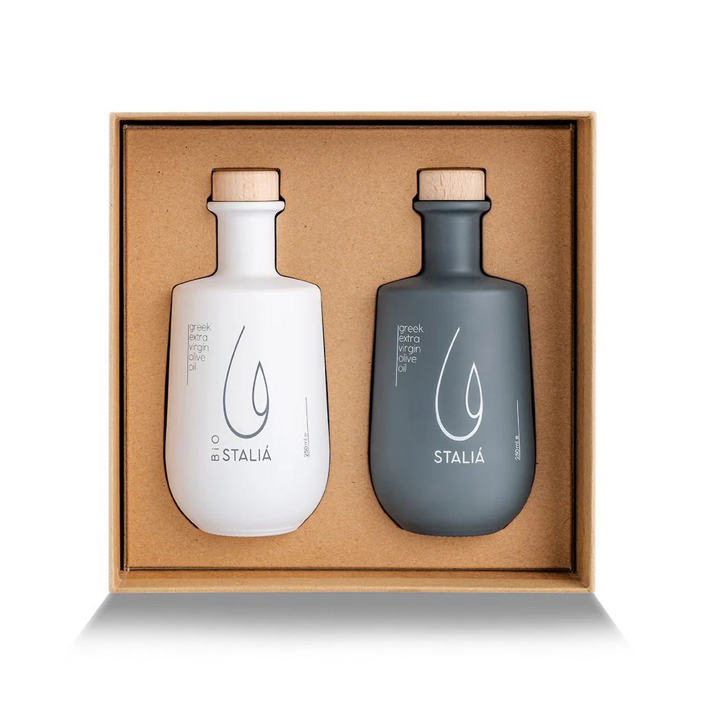 Two Stalia bottles, one white and one gray, in a cardboard box on a white background.