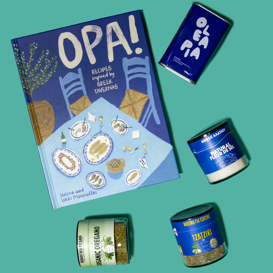 Cookbook titled 'Opa!' with Greek-themed products on a teal background
