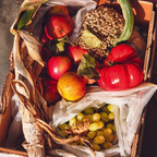 Basket filled with fruits and grains on a rustic background