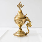 Decorative gold censer on a white background