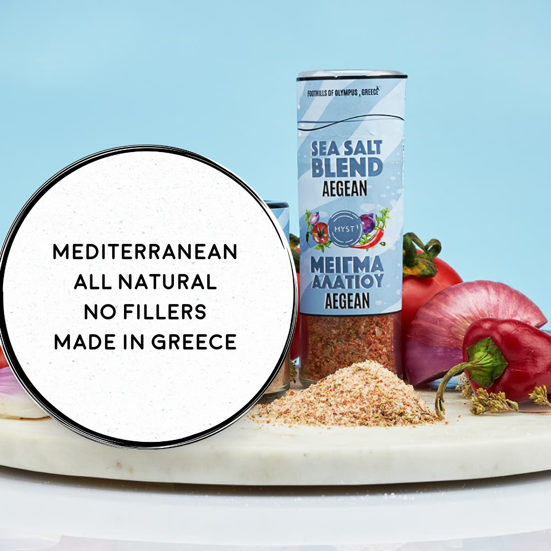 Sea salt blend container with ingredients on a marble board against a blue background