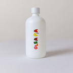 White bottle with colorful text on a light gray background
