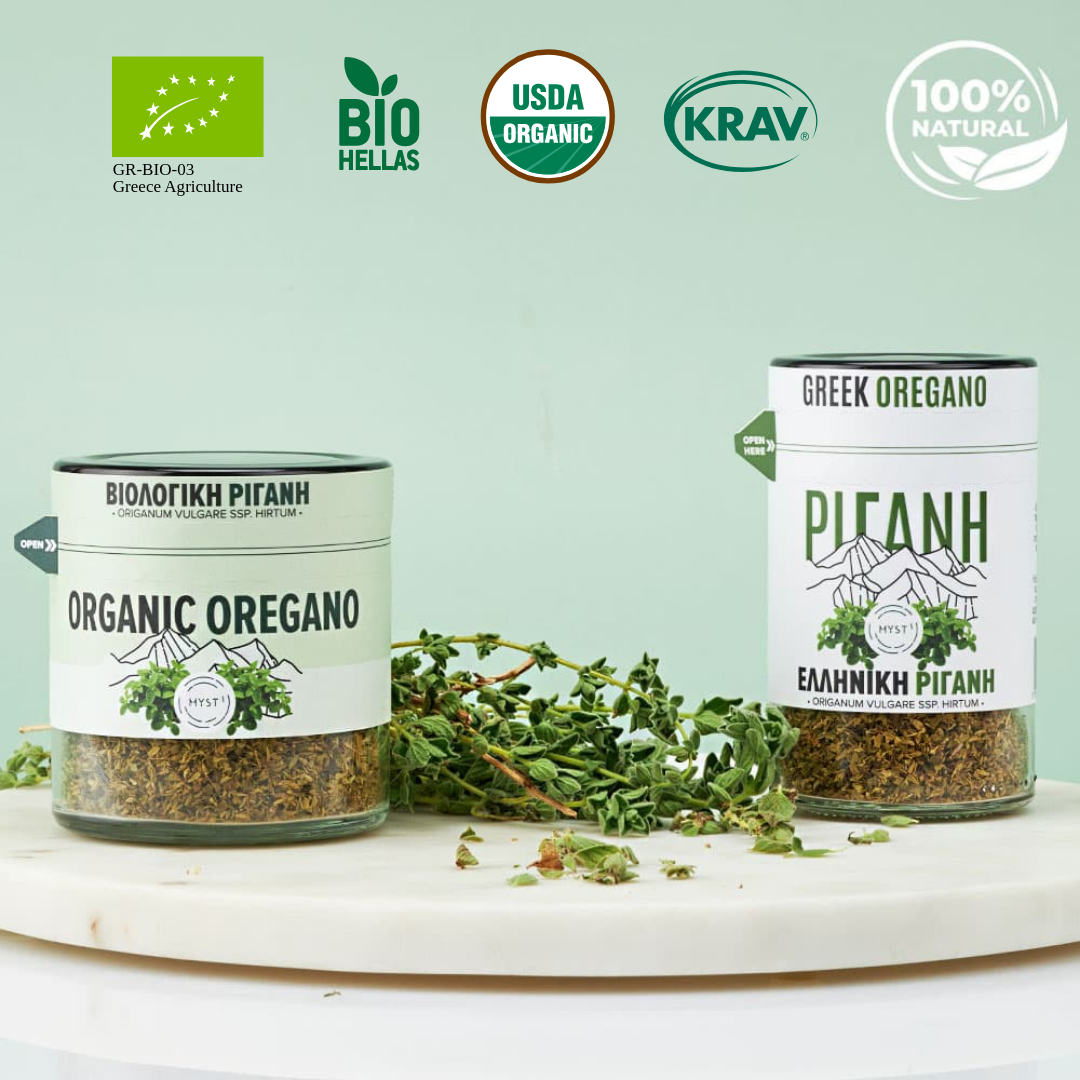 Two containers of Greek oregano with various organic certification logos on a light green background.