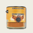 Jar of ground Ceylon cinnamon with a yellow label on a light gray background