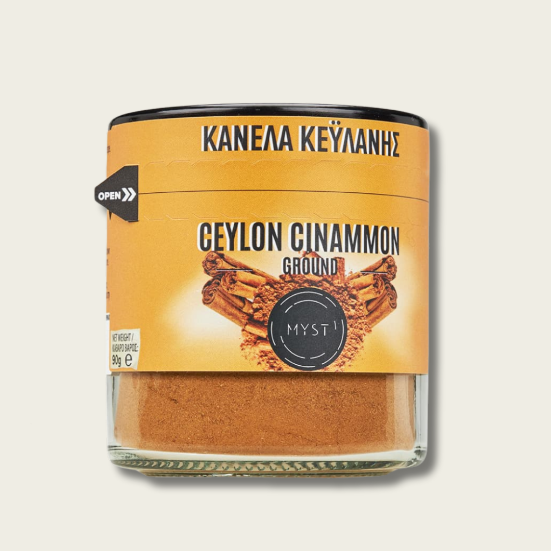 Jar of ground Ceylon cinnamon with a yellow label on a light gray background