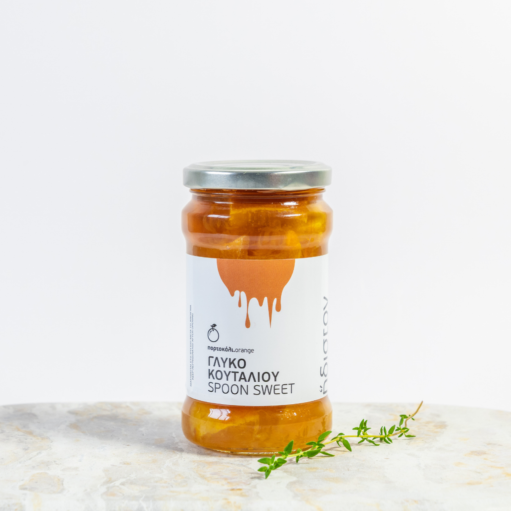 Jar of honey with a label on a marble surface