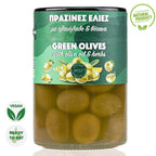 Jar of green olives with olive oil and herbs on a white background