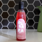 Bottle of OLEA PA on a kitchen counter with a hexagonal tile backsplash.
