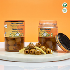 Two jars of green olives with a label on an orange background