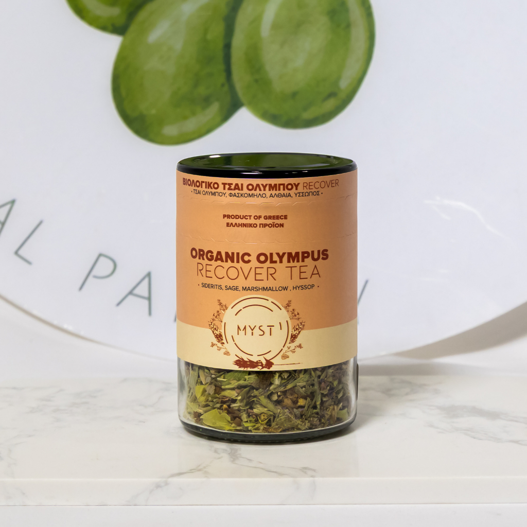 Jar of Organic Olympus Recover Tea with green leaves in the background