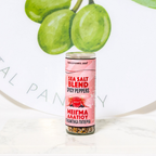 Sea salt blend container with spicy peppers on a white background
