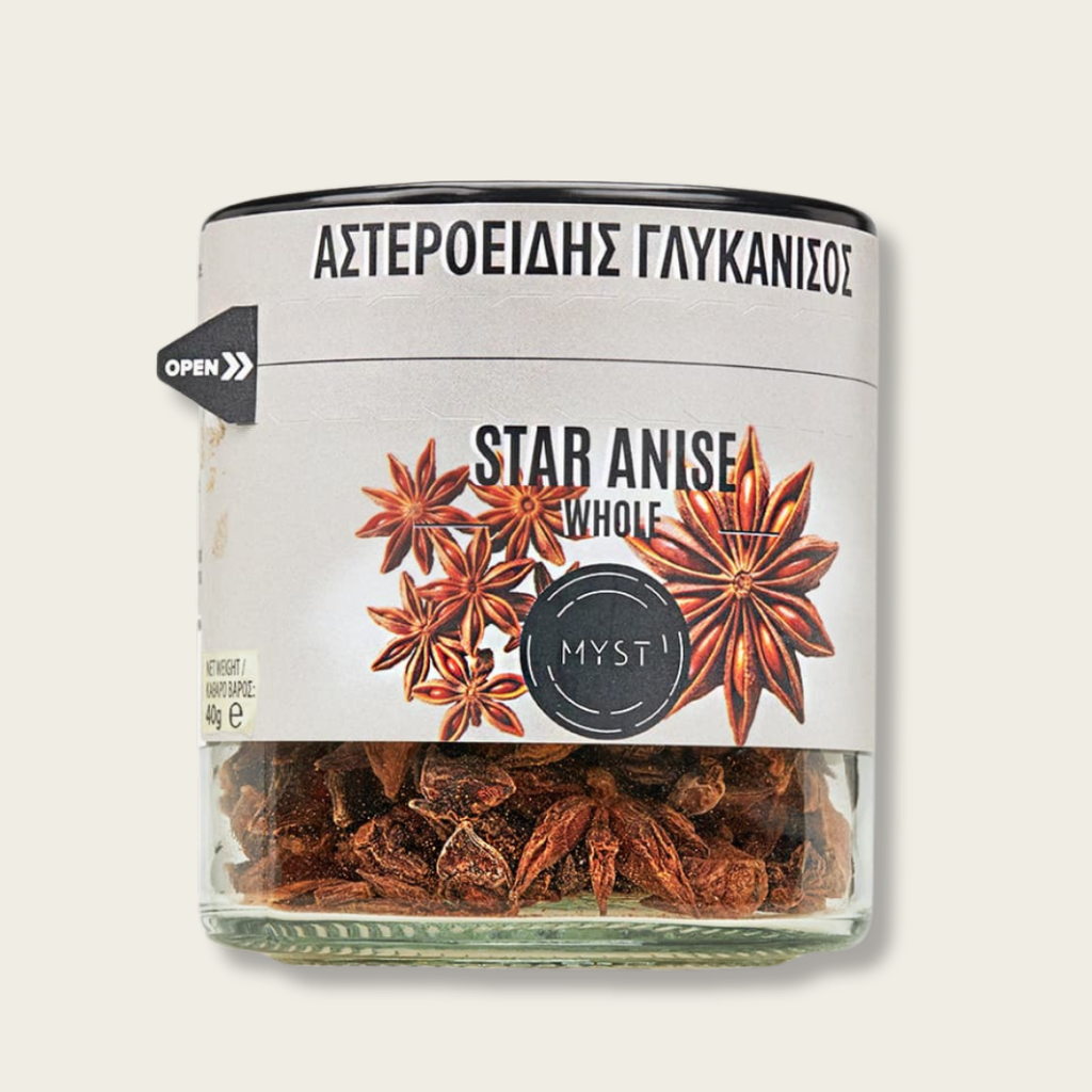 Jar of star anise with a label on a white background