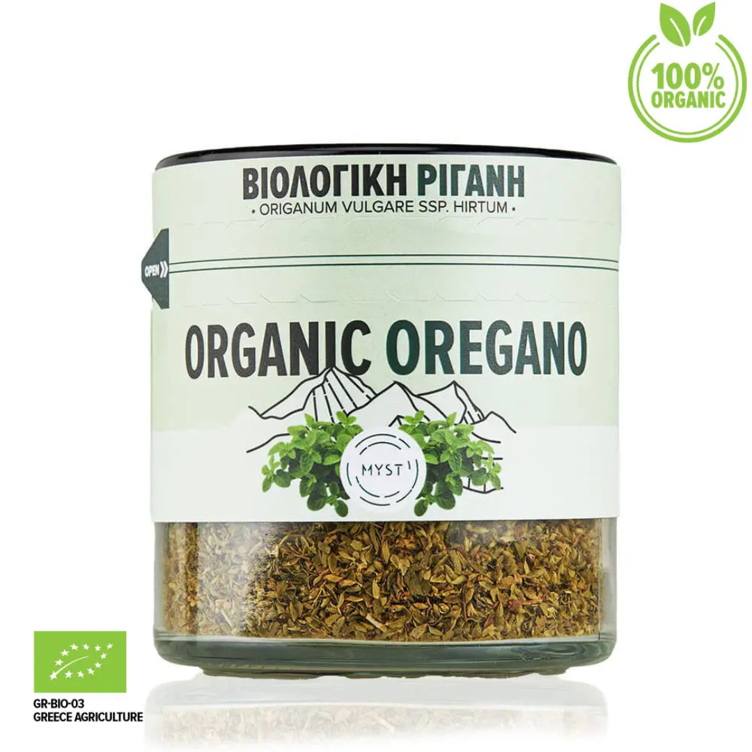 Jar of organic oregano with a green label on a white background