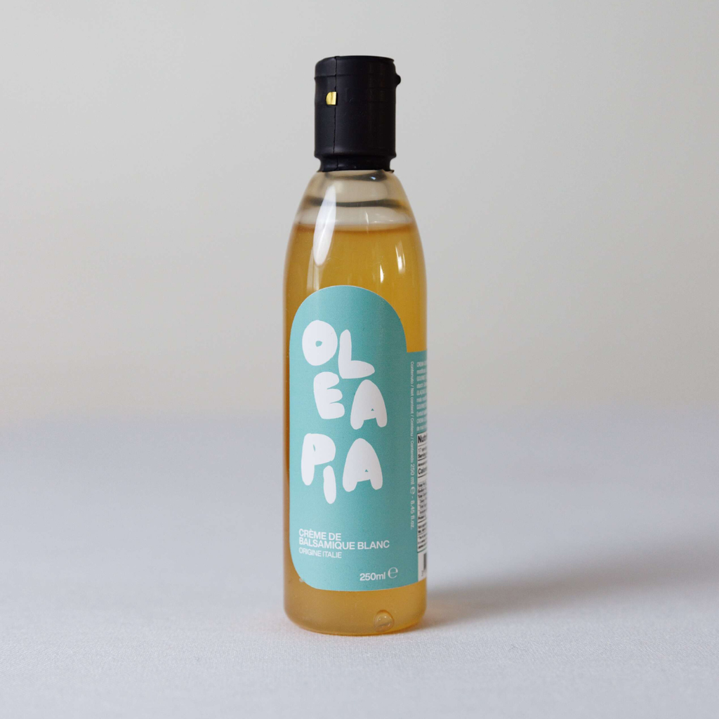 Bottle of Oléapia olive oil with a blue label on a white background